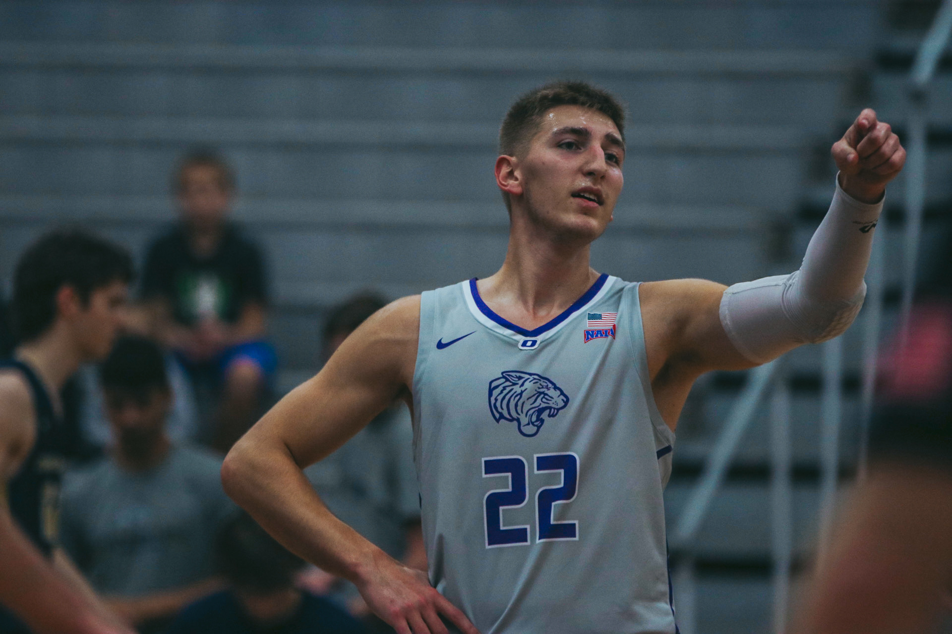 TIGERS USE LOCKDOWN SECOND-HALF DEFENSE TO GET PAST TROJANS
